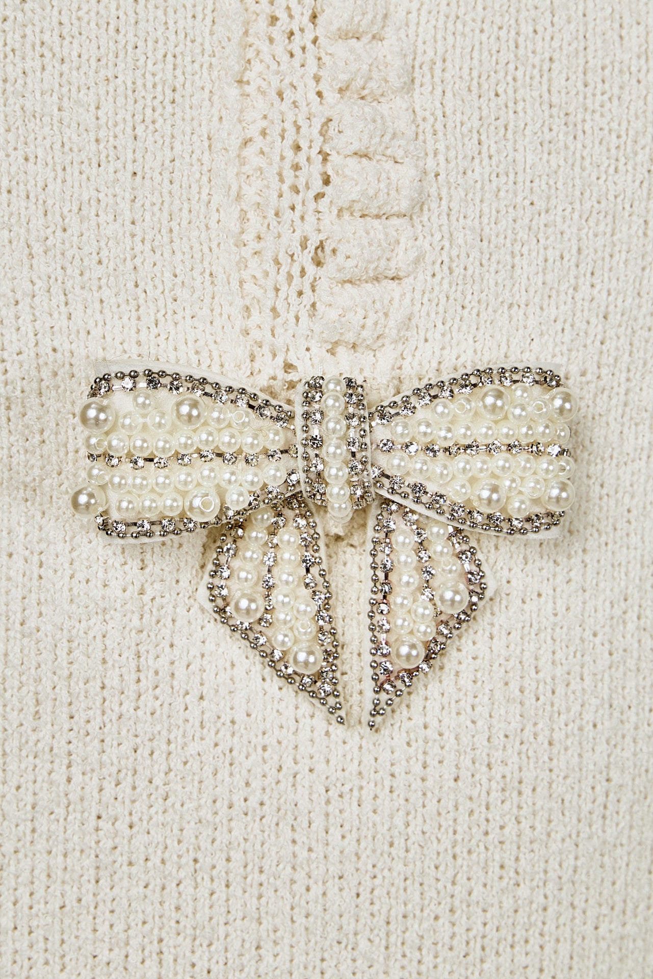 Sleeveless Mini Knit Dress With Bow Accents